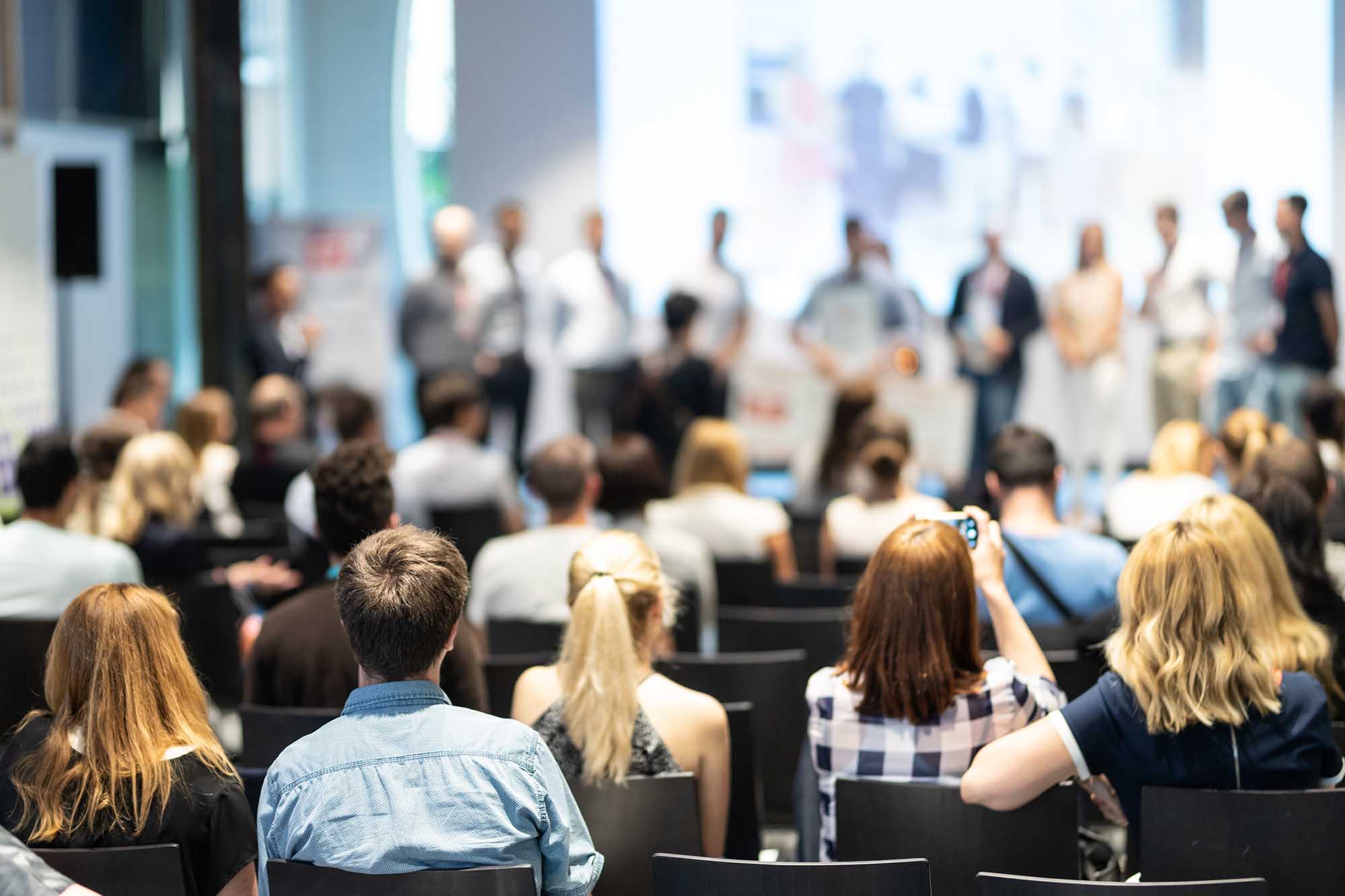 Young business team receiving award at best business project competition event